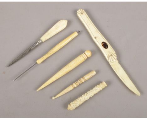 A small collection of ivory oddments. To include folding fruit knife and button hook.  