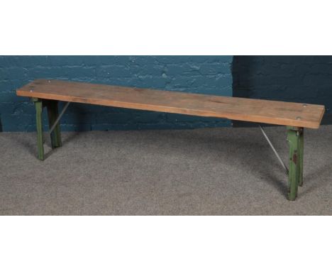A vintage bench with cast iron supports.  