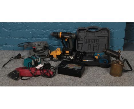 A bag of assorted power tools. Panasonic Hammer drill (EY6931) &amp; Panasonic universal charger EY0230, Power devil detail s
