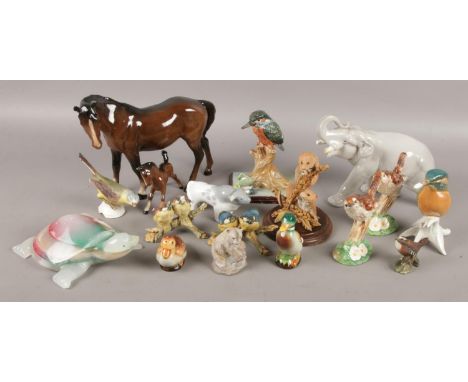 A collection of ceramic animals, to include examples from Beswick, Goebel and Border Fine Arts.  Chips to some examples.