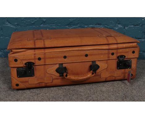 A vintage leather suitcase.  
