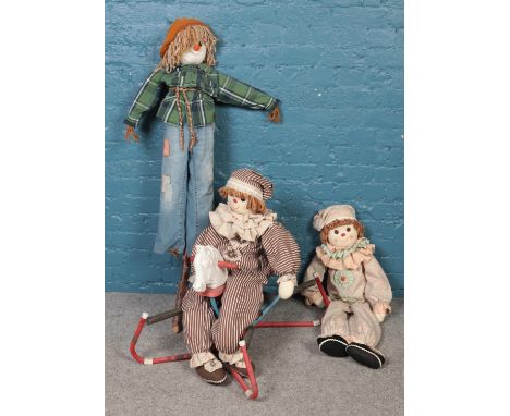 A vintage spring mounted rocking horse, together with three large hand-made ragdolls.  
