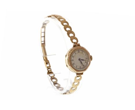 LADY'S EARLY TWENTIETH CENTURY NINE CARAT GOLD MANUAL WIND WRIST WATCHunsigned 17 jewel movement, the round dial with Arabic 