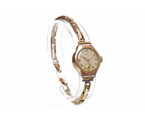 LADY'S NINE CARAT GOLD PAREX MANUAL WIND WRISTWATCHthe round white dial with Arabic hour markers, subsidiary dial at 6, 21mm 