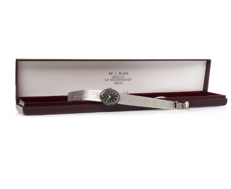 LADY'S ETERNA NINE CARAT WHITE GOLD MANUAL WIND COCKTAIL WATCHthe oval black dial with baton hour markers in white, 15mm case