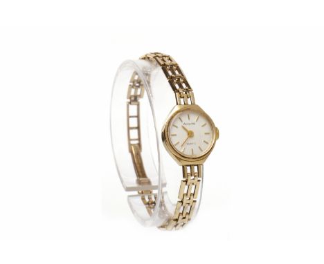 LADY'S ACCURIST NINE CARAT GOLD MANUAL WIND COCKTAIL WATCHthe round white dial with applied gold baton hour markers, 15mm cas