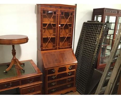 A reproduction yew wood bureau bookcase, the dentil cornice above a pair of glazed astragal panel doors, and fall front, encl