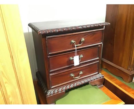 A hardwood miniature chest, the top with gadroon carved border above three drawers and gadroon moulded base, on bracket feet 