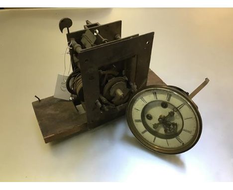 A 19thc longcase clock movement and a 19thc mantel clock movement with visible escapement and twin key apertures (longcase cl