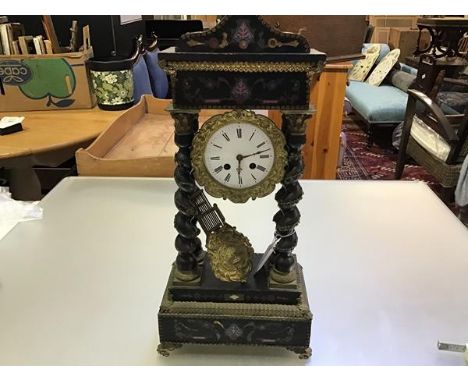 A 19thc ebonised and gilt mounted portico clock with arched top and enamelled dial, with twin key apertures, complete with pe