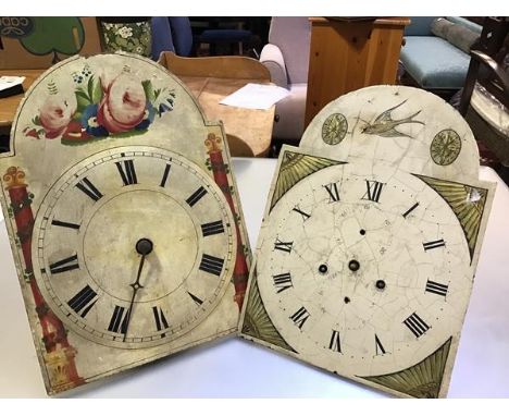 A 19thc painted arched dial longcase clock face and movement with roman numerals and a 19thc painted arched dial longcase clo