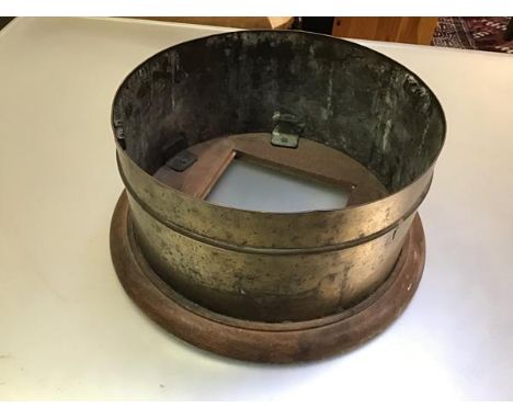 A ship's brass oak mounted compass holder (h.17cm x d.33cm)