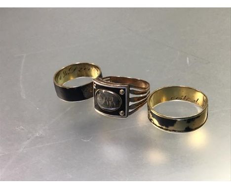 A 19thc black and white enamelled rectangular mourning ring with oval panel, with hair inset glazed panel with initials, (pos