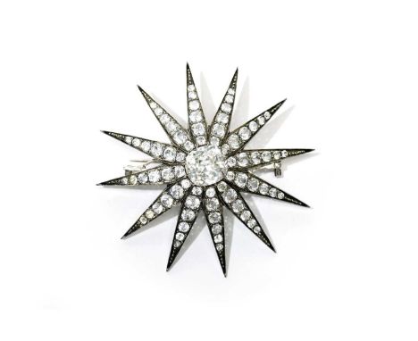 A Victorian paste star brooch, set with a central foil-backed cushion-cut paste stone, of convertible design, with a removabl