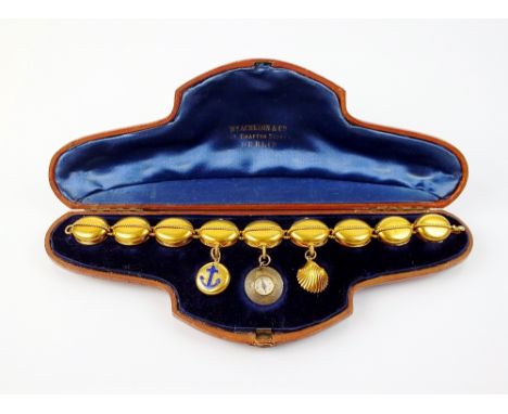 A 19th century sweetheart bracelet, the nine links formed as a ships 'block and tackle', the centre three suspend a shell mou