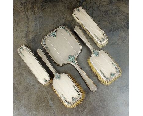 An Art Deco five piece silver mounted dressing table set, each piece with engine turned silver backs set with green and black