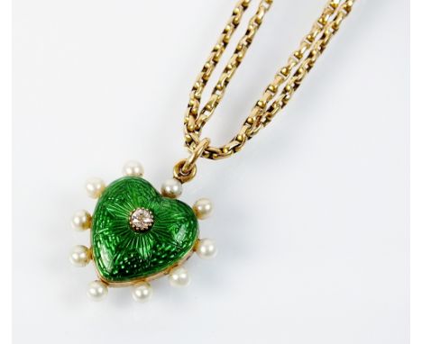 An early 20th century green enamel, seed pearl and diamond heart shaped pendant, the green enamel heart set with a central ol