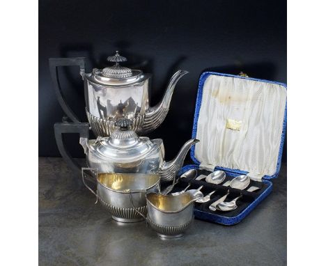 A bachelors three piece silver tea service, Henry Matthews, Birmingham 1922, each piece of oval half reeded form, comprising;
