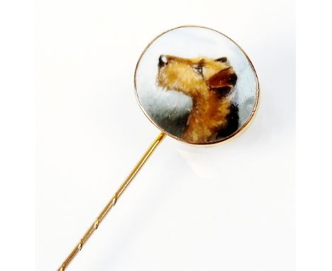 An enamelled stick pin, the oval enamel depicting the portrait of an Airedale terrier, set in yellow metal, the reverse stamp