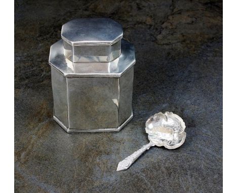 An Edwardian silver tea caddy, makers mark rubbed, London 1907, of canted plain polished form, 8.5cm high, together with a Wi
