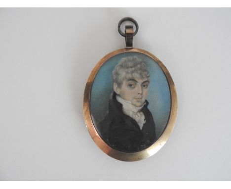 English school, circa 1800
Portrait of a gentleman, wearing a black coat and a white stock, in a gilt metal case with hair ba