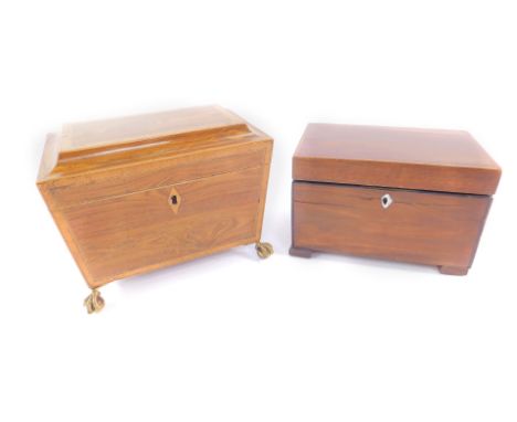 A Regency rosewood and satinwood cross banded sarcophagus tea caddy, twin division, raised on four brass claw and ball feet, 