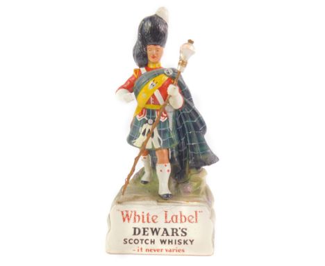 A Dewar's White Label Scotch Whiskey advertising figure, modelled as a Piper Major 'The McNab', 24.5cm H.