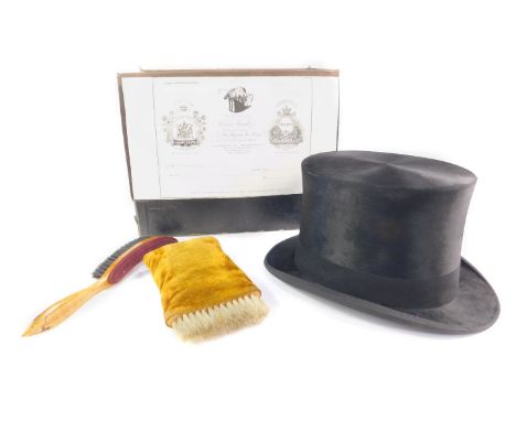 An early 20thC black top hat, internally initialled for R A Coleman, cased with brushes, internal length 8.25in, internal wid