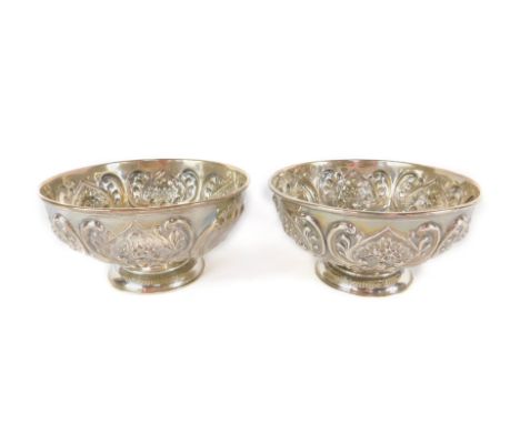 A pair of Victorian silver footed bowls, embossed with flowers and scrolling leaves, William Hutton &amp; Sons Ltd, London 18