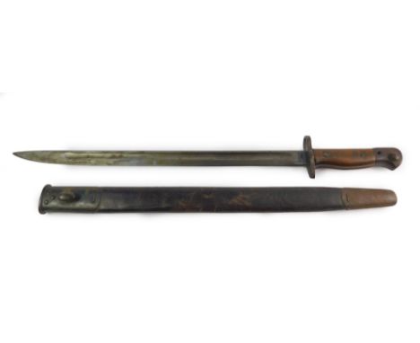 A Wilkinson WWI 1907 pattern sword bayonet, dated for 1917, the pommel with push button release, stamped wooden grip, blade b