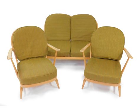 An Ercol light beech and oak three piece Windsor cottage suite, with green loose cushions, comprising two seater sofa, 133cm 