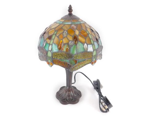 *A Tiffany style table lamp decorated in the dragonfly pattern, raised on a faux metal stemmed base, 42cm H, 25cm Dia. (boxed