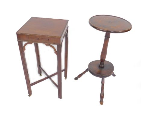 A Chippendale style mahogany night table, the square top with pull-out candle shelf, raised on square fluted legs, on castors