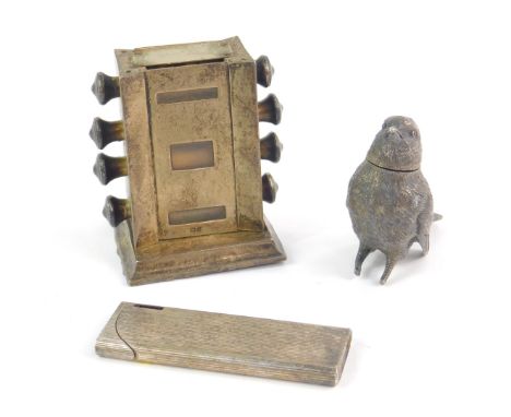 An Edward VII silver perpetual desk calendar, Birmingham 1907, a silver pepperette modelled as a bird, London 1903, (AF), and
