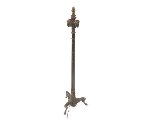 A late 19thC Continental green gesso standard lamp, the capital with three rams heads, raised on a fluted column over three l