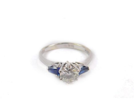 An 18ct white gold diamond and sapphire three stone ring, diamond approx 2/3ct, size K, 2.6g.