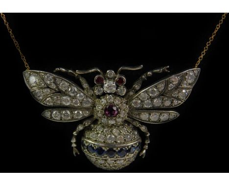 A Victorian diamond ruby and sapphire bumble bee pendant necklace, set in yellow metal on an 18ct gold chain, 13.4g.