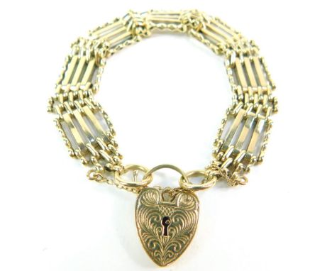 A 9ct gold five bar gate bracelet, on a heart shaped padlock clasp, with safety chain as fitted, 21.2g.