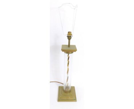 A Continental brass and spiral fluted table lamp, of column form raised on a stepped square base, signed indistinctly to base