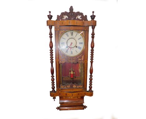 An American late 19thC marquetry inlaid wall clock, for J W Gibbins, Lincoln, circular enamel dial bearing Roman numerals, ei