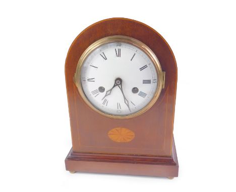 An Edwardian mahogany and inlaid domed mantel clock, circular enamel dial bearing Roman numerals, German 8-day movement, with