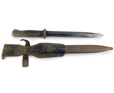 A Horster WWII German K98 bayonet, 1940, No 4291, with steel blade, and Bakelite grip, pommel with button release, with match