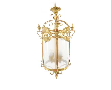 A brass and glass cylindrical hall lantern, four light form, 68cm H.