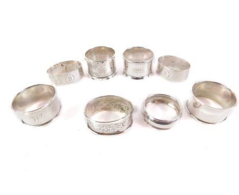 A pair of George V silver napkin rings, with engine turned decoration, reserve and initial engraved, Birmingham 1935, and six