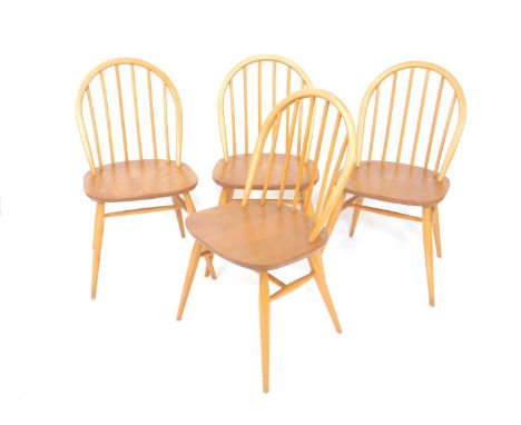 A set of four Ercol ash and elm stick back kitchen chairs.