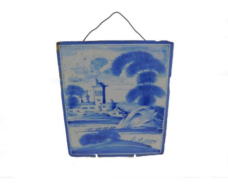 An English 18thC Delft ware tile, painted in blue and white with a manor house in a river landscape, 21.5cm H, 19cm W.