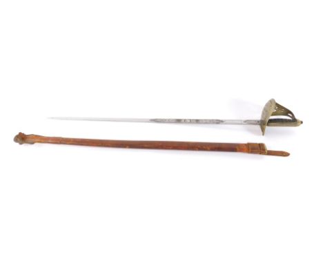 A George V 1897 pattern Infantry sword, with an etched blade and steel guard, wire bound fish skin grip, with leather scabbar