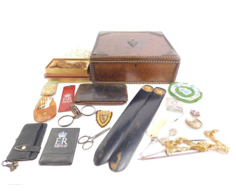 A carved oak box, 10.5cm H, 29.5cm W, 27cm D, with contents including lace work, tools, a lock of hair, two paper knives and 