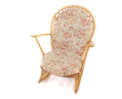 An Ercol ash and elm Windsor chair, with floral loose cushion seats.