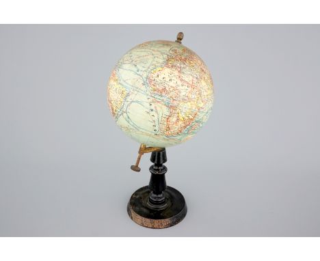 A globe on wood stand, edited by Forest in Paris, ca. 1925 H.: 47 cm Condition reports and high resolution pictures are avail